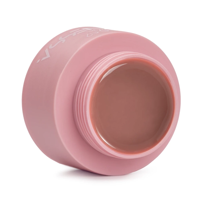 Płynny akrylożel Liquid AcrylicGel Natural Beige 50 ml w otwartym, różowym słoiczku, widoczne półtransparentne beżowe wnętrze produktu