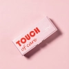 Różowe pudełko zestawu suchych oliwek do skórek Touch of care